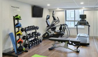 Fully equipped fitness center at Holiday Inn Express Toronto Downtown.