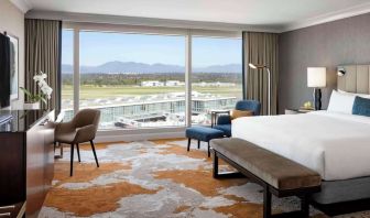 Bright and spacious day use room with TV, sofa, work desk and private bathroom at Fairmont Vancouver Airport - YVR Terminal Hotel.