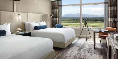 Day use twin room with TV, sofa, work desk and private bathroom at Fairmont Vancouver Airport - YVR Terminal Hotel. 