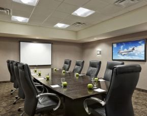 Professional meeting room with ergonomic chairs at Acclaim Hotel Calgary Airport.