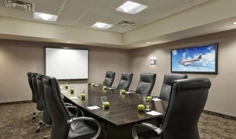 Professional meeting room with ergonomic chairs at Acclaim Hotel Calgary Airport.