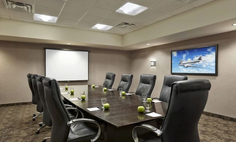 Professional meeting room with ergonomic chairs at Acclaim Hotel Calgary Airport.