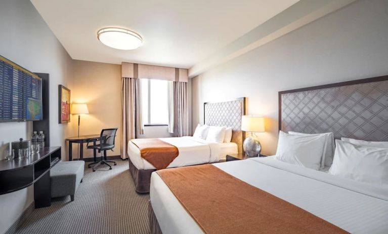 Day use twin room with work desk and private bathroom at Acclaim Hotel Calgary Airport.