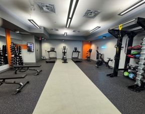 Fully equipped fitness center at Acclaim Hotel Calgary Airport.