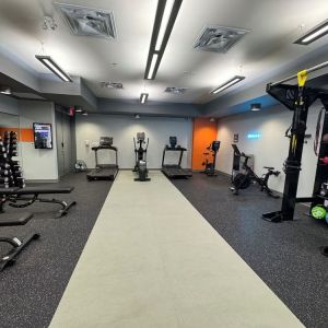 Fully equipped fitness center at Acclaim Hotel Calgary Airport.