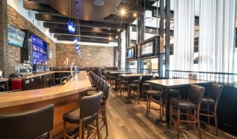 Hotel bar with lounge seating at Acclaim Hotel Calgary Airport.