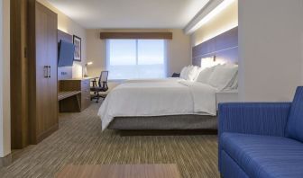 Day use room with TV, work desk, living area and private bathroom at Holiday Inn Express & Suites North Bay.