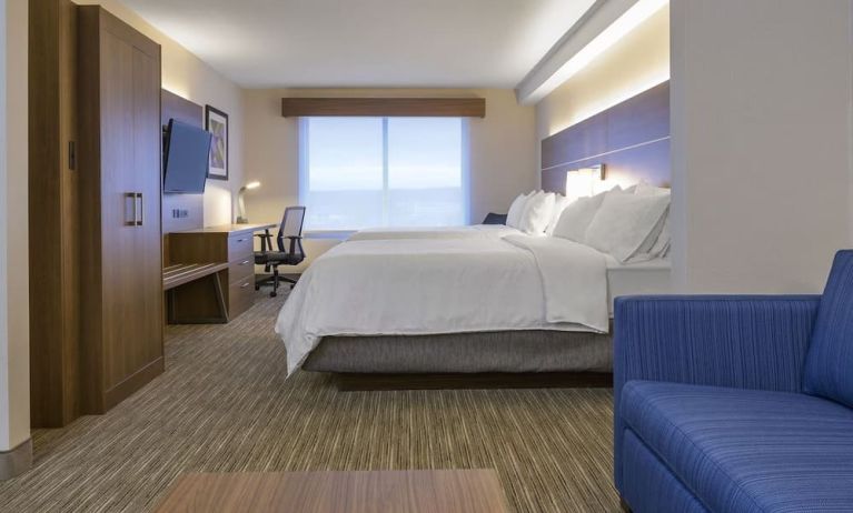 Day use room with TV, work desk, living area and private bathroom at Holiday Inn Express & Suites North Bay.