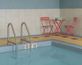 Indoor pool with seating at Holiday Inn Express & Suites North Bay.