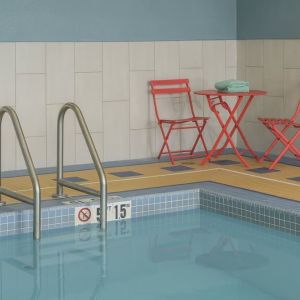 Indoor pool with seating at Holiday Inn Express & Suites North Bay.