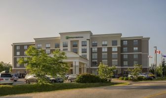 Hotel exterior with parking area at Holiday Inn Express & Suites North Bay.