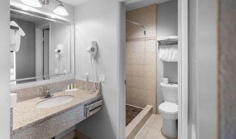 Guest bathroom with shower at The Live Hotel.