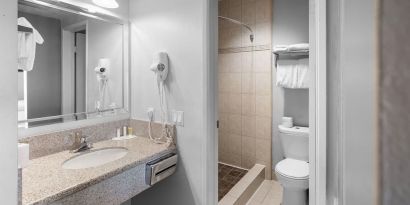 Guest bathroom with shower at The Live Hotel.