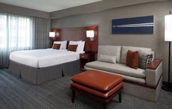 Day use room with sofa at Courtyard By Marriott Los Angeles LAX/Century Boulevard.