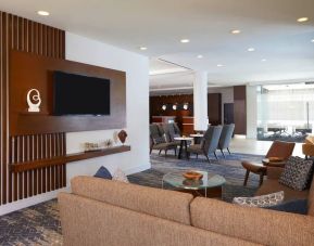 Lobby and coworking lounge at Courtyard By Marriott Los Angeles LAX/Century Boulevard.