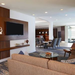 Lobby and coworking lounge at Courtyard By Marriott Los Angeles LAX/Century Boulevard.