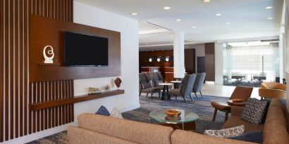 Lobby and coworking lounge at Courtyard By Marriott Los Angeles LAX/Century Boulevard.