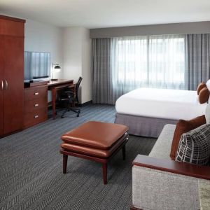 Day use room with sofa and work desk at Courtyard By Marriott Los Angeles LAX/Century Boulevard.