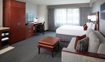 Day use room with sofa and work desk at Courtyard By Marriott Los Angeles LAX/Century Boulevard.