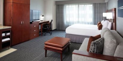 Day use room with sofa and work desk at Courtyard By Marriott Los Angeles LAX/Century Boulevard.