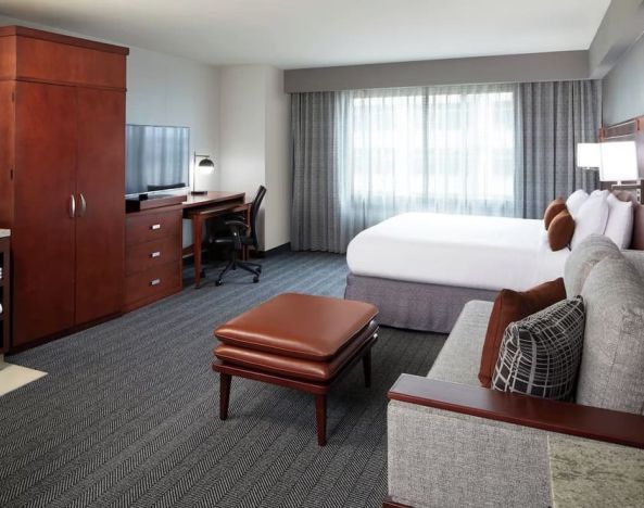 Day use room with sofa and work desk at Courtyard By Marriott Los Angeles LAX/Century Boulevard.