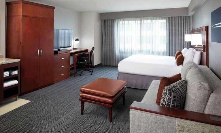 Day use room with sofa and work desk at Courtyard By Marriott Los Angeles LAX/Century Boulevard.