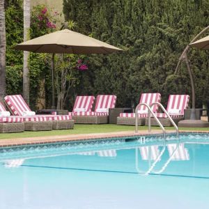 Sun loungers beside pool at Hollywood Hotel.