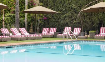 Sun loungers beside pool at Hollywood Hotel.