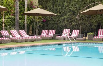 Sun loungers beside pool at Hollywood Hotel.