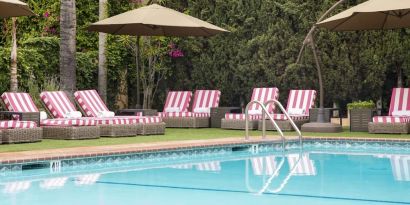 Sun loungers beside pool at Hollywood Hotel.