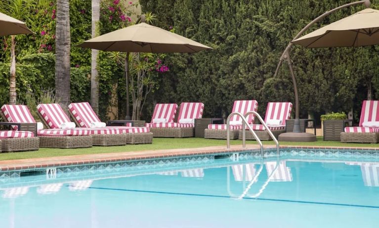 Sun loungers beside pool at Hollywood Hotel.