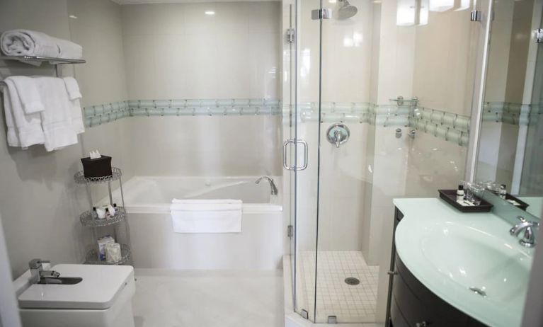 Guest bathroom with shower and tub at The Mutiny Hotel.