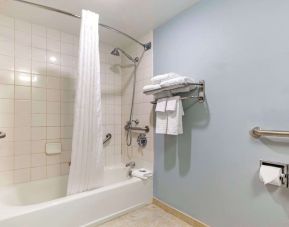 Guest bathroom with shower and tub at Best Western Hartford Hotel & Suites.