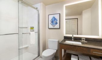 Guest bathroom with shower at Candlewood Suites Meridian.