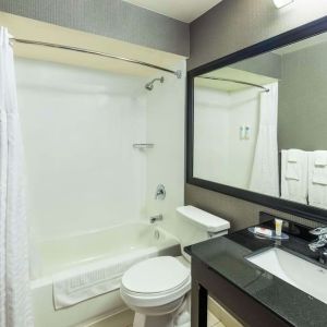 Private guest bathroom with tub at Comfort Inn Corner Brook.