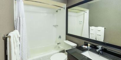 Private guest bathroom with tub at Comfort Inn Corner Brook.