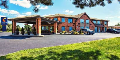 Hotel exterior and parking area at Comfort Inn Yarmouth.