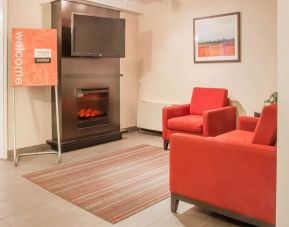 Lobby lounge with fireplace at Comfort Inn Winnipeg II South.