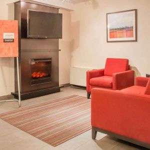 Lobby lounge with fireplace at Comfort Inn Winnipeg II South.