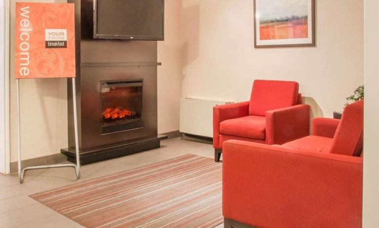 Lobby lounge with fireplace at Comfort Inn Winnipeg II South.