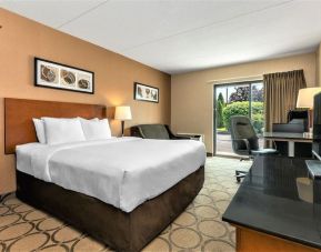 Day use room with TV, sofa, work desk and private bathroom at Comfort Inn Winnipeg II South.