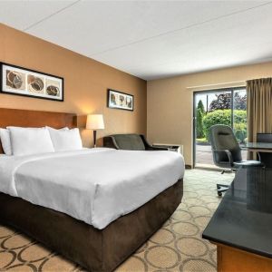 Day use room with TV, sofa, work desk and private bathroom at Comfort Inn Winnipeg II South.