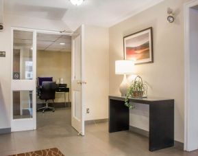 Business center with computer, printer and ergonomic chair at Comfort Inn Winnipeg II South.