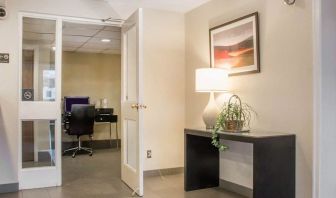 Business center with computer, printer and ergonomic chair at Comfort Inn Winnipeg II South.