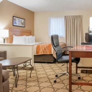 Day use suite with work desk and living area at Comfort Inn Winnipeg II South.