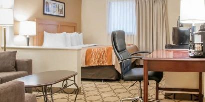 Day use suite with work desk and living area at Comfort Inn Winnipeg II South.