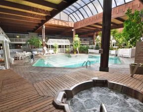 Indoor pool and spa tub at Sturbridge Host Hotel.