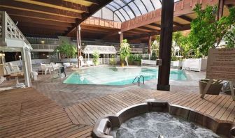 Indoor pool and spa tub at Sturbridge Host Hotel.