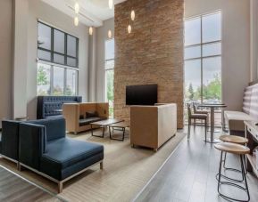 Lobby and coworking lounge at Cambria Suites Denver Airport.