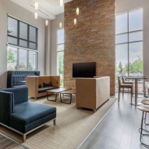 Lobby and coworking lounge at Cambria Suites Denver Airport.